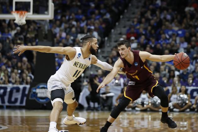 Loyola-Chicago guard Clayton Custer (13) works against Nevada forward Cody Martin (11) during the second half of a regional semifinal NCAA college basketball game, Thursday, March 22, 2018, in Atlanta. (AP Photo/David Goldman)