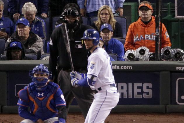 Baseball fan Laurence Leavy, right, watches during the 12th inning of Game 1 of the Major League Baseball World Series between the Kansas City Royals and the New York Mets Tuesday, Oct. 27, 2015, in Kansas City, Mo. (AP Photo/Charlie Riedel)