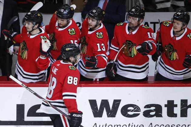 Chicago Blackhawks right wing Patrick Kane (88) celebrates with teammates after scoring against the Winnipeg Jets during the first period of an NHL hockey game Thursday, March 29, 2018, in Chicago. (AP Photo/Kamil Krzaczynski)