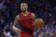 Portland Trail Blazers guarding Damian Lillard (0) during an NBA basketball match against the Oklahoma City Thunder in Oklahoma City, Sunday, March 25, 2018. (AP Photo / Sue Ogrocki)