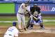 San Francisco Giants' Joe Panik, second from left, hits a solo home run as Los Angeles Dodgers starting pitcher Clayton Kershaw, left, watches along with catcher Yasmani Grandal, right, and home plate umpire Mark Wegner, top right, during the fifth inning of an opening day baseball game Thursday, March 29, 2018, in Los Angeles. (AP Photo/Mark J. Terrill)