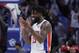Detroit Pistons forward Reggie Bullock (25) reacts after the Pistons defeated the New York Knicks in an NBA basketball game, Friday, Dec. 22, 2017, in Detroit. (AP Photo/Carlos Osorio)