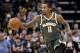 Milwaukee Bucks guard Brandon Jennings (11) brings the ball upcourt in the first half of an NBA basketball game against the Memphis Grizzlies, Monday, March 12, 2018, in Memphis, Tenn. (AP Photo/Brandon Dill)
