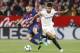 Barcelona's Jordi Alba, left, and Sevilla's, Correa, fight for the ball during La Liga soccer match between Barcelona and Sevilla at the Sanchez Pizjuan stadium, in Seville, Spain on Saturday, March 31, 2018. (AP Photo/Miguel Morenatti)
