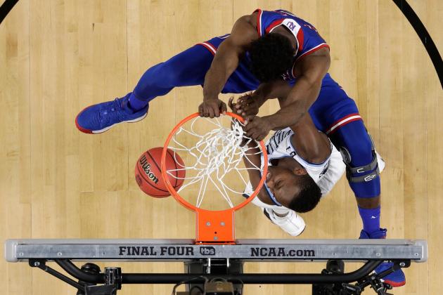 Kansas's Udoka Azubuike, top, dunks over Villanova's Dhamir Cosby-Roundtree during the first half in the semifinals of the Final Four NCAA college basketball tournament, Saturday, March 31, 2018, in San Antonio. (AP Photo/David J. Phillip)