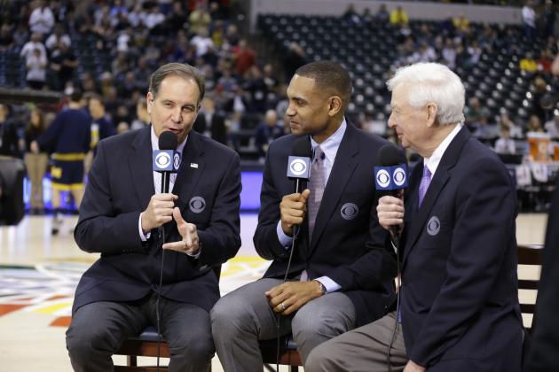FILE - In this March 12, 2016 file photo, CBS broadcasters, left to right, play-by-play commentator Jim Nantz, along with game analyses Grant Hill and Bill Raftery work before NCAA college basketball game during the semifinals of the Big Ten Conference tournament in Indianapolis. With eight years left on their deal to broadcast the NCAA Tournament, CBS and Turner are tacking on another eight. The extension announced Tuesday, April 12, 2016, goes all the way through 2032. T(AP Photo/Michael Conroy, File)