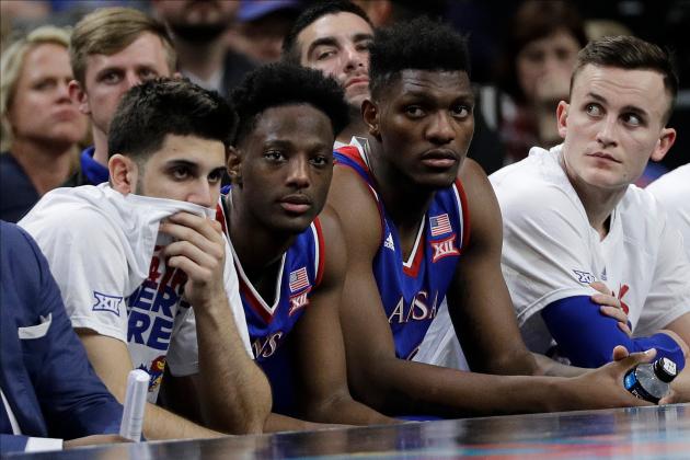 Kansas players watches from the bench during the second half in the semifinals of the Final Four NCAA college basketball tournament against Villanova, Saturday, March 31, 2018, in San Antonio. (AP Photo/David J. Phillip)