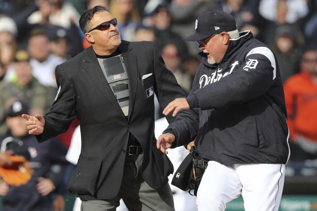 Detroit Tigers manager Ron Gardenhire kicks dirt on home plate next to umpire Tony Randazzo after a play was overturned during the tenth inning of a baseball game against the Pittsburgh Pirates, Friday, March 30, 2018, in Detroit. Gardenhire was ejected by Randazzo. (AP Photo/Carlos Osorio)