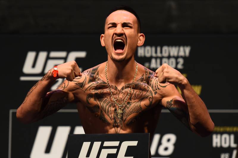 DETROIT, MI - DECEMBER 01: Max Holloway poses on the scale during the UFC 218 weigh-in inside Little Caesars Arena on December 1, 2017 in Detroit, Michigan. (Photo by Josh Hedges/Zuffa LLC/Zuffa LLC via Getty Images)
