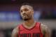 Portland Trail Blazers guard Damian Lillard walks up court in the second half of an NBA basketball game against the Dallas Mavericks in Dallas, Tuesday, April 3, 2018. Lillard lead all scoring with 29 points in the 115-109 loss to the Mavericks. (AP Photo/Tony Gutierrez)