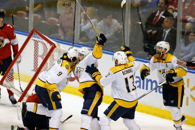 Nashville Predators players including Nashville Predators left wing Viktor Arvidsson, third from left, and left wing Filip Forsberg (9) celebrate what appeared to be a goal in the final seconds of play against the Florida Panthers in an NHL hockey game, Tuesday, April 3, 2018, in Sunrise, Fla. The goal, which would have tied the game, was disallowed. The Panthers won the game 2-1. (AP Photo/Joe Skipper)