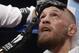 Conor McGregor sits in his corner between rounds in a super welterweight boxing match against Floyd Mayweather Jr., Saturday, Aug. 26, 2017, in Las Vegas. (AP Photo/Isaac Brekken)