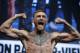 Conor McGregor poses on the scale during a weigh-in Friday, Aug. 25, 2017, in Las Vegas. McGregor is scheduled to fight Floyd Mayweather Jr. in a boxing bout Saturday (AP Photo/John Locher)