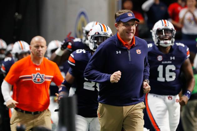 ATLANTA, GA - DECEMBER 02: Head coach Gus Malzahn of the Auburn Tigers runs out of the tunnel with his team prior to the game against the Auburn Tigers in the SEC Championship at Mercedes-Benz Stadium on December 2, 2017 in Atlanta, Georgia. (Photo by Kevin C. Cox/Getty Images)
