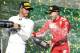 Ferrari driver Sebastian Vettel, right, of Germany and Mercedes driver Lewis Hamilton of Britain spray champagne after the first race of the season at the Australian Formula One Grand Prix in Melbourne, Sunday, March 25, 2018. Vettel won ahead of Hamilton while Ferrari driver Kimi Raikkonen of Finland finished 3rd. (AP Photo/Asanka Brendon Ratnayake)