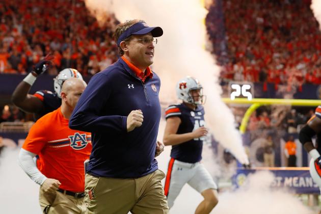 ATLANTA, GA - DECEMBER 02: Head coach Gus Malzahn of the Auburn Tigers runs out of the tunnel with his team prior to the game against the Auburn Tigers in the SEC Championship at Mercedes-Benz Stadium on December 2, 2017 in Atlanta, Georgia. (Photo by Kevin C.  Cox/Getty Images)
