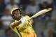 Chennai Super Kings cricketer Dwayne Bravo plays a shot during the 2018 Indian Premier League (IPL) Twenty20 cricket match between Mumbai Indians and Chennai Super Kings at the Wankhede stadium in Mumbai on April 7, 2018. / AFP PHOTO / PUNIT PARANJPE / ALTERNATIVE CROP (Photo credit should read PUNIT PARANJPE/AFP/Getty Images)
