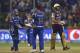 Mumbai Indians Karn Sharma, centre, celebrates with wicket keeper Parthiv Patel, left, the wicket of Colin De Grandhomme of Kolkata Knight Riders during the Indian Premier League cricket eliminator match in Bangalore, India, Friday, May 19, 2017. (AP Photo)