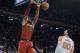 Cleveland Cavaliers' LeBron James, left, dunks over New York Knicks' Enes Kanter (00) during the first half of a NBA basketball game at Madison Square Garden in New York, Monday, Nov. 13, 2017. (AP Photo/Andres Kudacki)