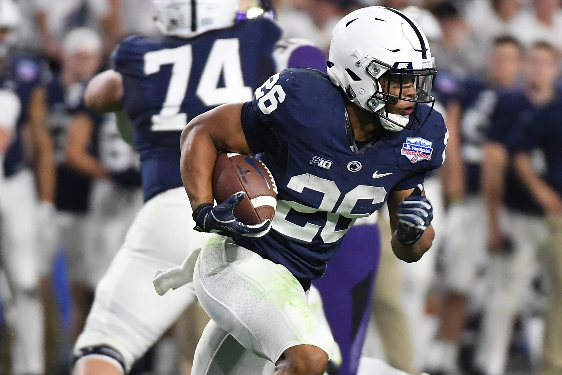 GLENDALE, AZ - DECEMBER 30: Saquon Barkley #26 of Penn State Nittany Lions rusn with the ball against the Washington Huskies during the Playstation Fiesta Bowl at University of Phoenix Stadium on December 30, 2017 in Glendale, Arizona. (Photo by Norm Hall/Getty Images)