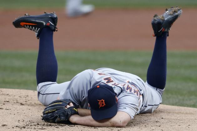 Detroit Tigers starting pitcher Jordan Zimmermann lays on the mound after getting hit by a ball off the bat of Cleveland Indians' Jason Kipnis during the first inning in a baseball game, Wednesday, April 11, 2018, in Cleveland. (AP Photo/Ron Schwane)