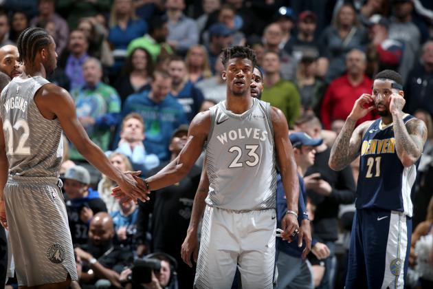 MINNEAPOLIS, MN - APRIL 11:  Andrew Wiggins #22 and Jimmy Butler #23 of the Minnesota Timberwolves high five during the game against the Denver Nuggets on April 11, 2018 at Target Center in Minneapolis, Minnesota. NOTE TO USER: User expressly acknowledges and agrees that, by downloading and or using this Photograph, user is consenting to the terms and conditions of the Getty Images License Agreement. Mandatory Copyright Notice: Copyright 2018 NBAE (Photo by David Sherman/NBAE via Getty Images)