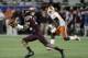 Virginia Tech linebacker Terrell Edmunds (22) makes a catch ahead of Clemson running back Tavien Feaster (28), during the first half of the American Coast Conference championship NCAA college football game, Saturday, Dec. 3, 2016, in Orlando, Fla. (AP Photo/Chris O'Meara)