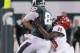EAST LANSING, MI - AUGUST 29: Tight end Josiah Price #82 of the Michigan State Spartans is tackled by safety Siran Neal #28 of the Jacksonville State Gamecocks on a 32-yard reception during the second half at Spartan Stadium on August 29, 2014 in East Lansing, Michigan. Michigan State defeated Jacksonville State 45-7. (Photo by Duane Burleson/Getty Images)