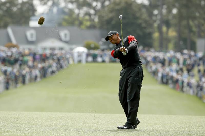 Tiger Woods hits on the first fairway during the fourth round at the Masters golf tournament Sunday, April 8, 2018, in Augusta, Ga. (AP Photo/Charlie Riedel)