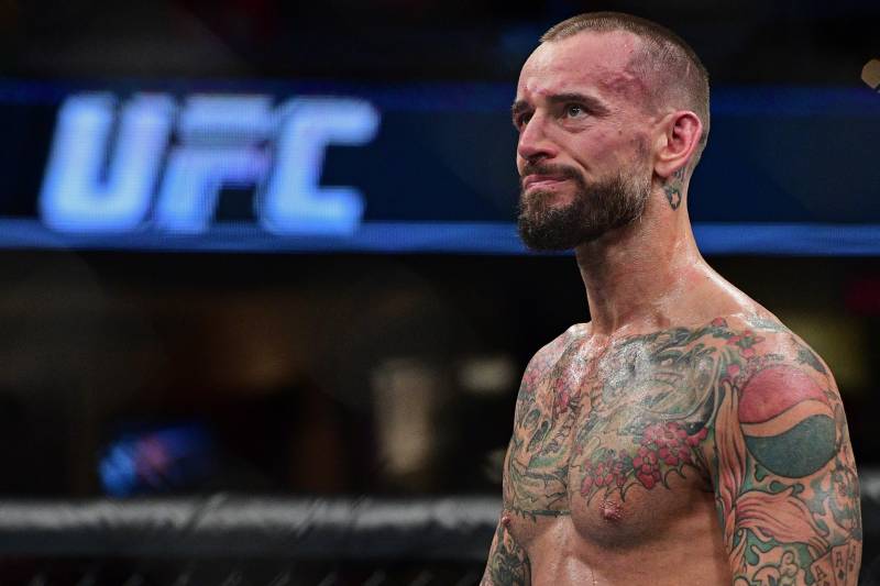 CM Punk stands in the octagon after being defeated by Mickey Gall during a welterweight bout at UFC 203 on Saturday, Sept. 10, 2016, in Cleveland. (AP Photo/David Dermer)