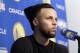 Golden State Warriors guard Stephen Curry speaks at a news conference before an NBA basketball game between the Warriors and the Utah Jazz in Oakland, Calif., Sunday, March 25, 2018. (AP Photo/Jeff Chiu)