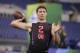 Wyoming quarterback Josh Allen runs a drill at the NFL football scouting combine in Indianapolis, Saturday, March 3, 2018. (AP Photo/Michael Conroy)