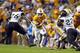 Tennessee running back John Kelly (4) runs for yardage as he's defended by Southern Mississippi linebacker Jeremy Sangster (26) in the first half of an NCAA college football game Saturday, Nov. 4, 2017, in Knoxville, Tenn. (AP Photo/Wade Payne)