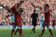 Liverpool's Senegalese midfielder Sadio Mane (3rd L) celebrates with teammates after scoring the opening goal of the English Premier League football match between Liverpool and Bournemouth at Anfield in Liverpool, north west England on April 14, 2018. / AFP PHOTO / Lindsey PARNABY / RESTRICTED TO EDITORIAL USE. No use with unauthorized audio, video, data, fixture lists, club/league logos or 'live' services. Online in-match use limited to 75 images, no video emulation. No use in betting, games or single club/league/player publications. / (Photo credit should read LINDSEY PARNABY/AFP/Getty Images)