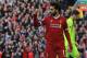 Liverpool's Egyptian midfielder Mohamed Salah celebrates after scoring their second goal during the English Premier League football match between Liverpool and Bournemouth at Anfield in Liverpool, north west England on April 14, 2018. / AFP PHOTO / Lindsey PARNABY / RESTRICTED TO EDITORIAL USE. No use with unauthorized audio, video, data, fixture lists, club/league logos or 'live' services. Online in-match use limited to 75 images, no video emulation. No use in betting, games or single club/league/player publications. / (Photo credit should read LINDSEY PARNABY/AFP/Getty Images)