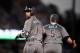 Arizona Diamondbacks' Deven Marrero, left, looks back toward the first base coach as Alex Avila runs in front of him after hitting a three-run home run during the fourth inning of a baseball game against the Los Angeles Dodgers, Saturday, April 14, 2018, in Los Angeles. Avila was later called out for passing Avila following a review. (AP Photo/Mark J. Terrill)