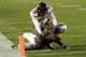 Texas Tech wide receiver Keke Coutee (20) dives over Iowa State defensive back Evrett Edwards while scoring on an 11-yard touchdown reception during the second half of an NCAA college football game, Saturday, Nov. 19, 2016, in Ames, Iowa. Iowa State won 66-10. (AP Photo/Charlie Neibergall)