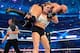 Ronda Rousey slams Triple H at WrestleMania 34.