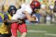 Texas Tech wide receiver Dylan Cantrell (14) is tackle by West Virginia safety Dravon Askew-Henry (6) during the first half of an NCAA college football game, Saturday, Oct. 14, 2017, in Morgantown, W.Va. (AP Photo/Raymond Thompson)