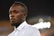 Jamaica's former sprinter Usain Bolt is seen during the athletics women's 200m medal ceremony during the 2018 Gold Coast Commonwealth Games at the Carrara Stadium on the Gold Coast on April 12, 2018. / AFP PHOTO / SAEED KHAN (Photo credit should read SAEED KHAN/AFP/Getty Images) Jamaica's former sprinter Usain Bolt is seen during the athletics women's 200m medal ceremony during the 2018 Gold Coast Commonwealth Games at the Carrara Stadium on the Gold Coast on April 12, 2018. / AFP PHOTO / SAEED KHAN (Photo credit should read SAEED KHAN/AFP/Getty Images)