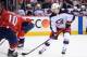 Columbus Blue Jackets left wing Artemi Panarin (9), of Russia, skates with the puck during the second period in Game 1 of an NHL first-round hockey playoff series against Washington Capitals right wing Brett Connolly (10), Thursday, April 12, 2018, in Washington. (AP Photo/Nick Wass)