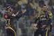 Kolkata Night Riders' teammate congratulates Sunil Narine, right for taking Delhi Daredevils' Chris Morris during VIVO IPL cricket T20 match in Kolkata, India, Monday, April 16, 2018. (AP Photo/Bikas Das)