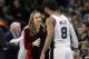 San Antonio Spurs assistant coach Becky Hammon, left, talks with guard Patty Mills (8) during the second half of an NBA basketball game against the New York Nets, Tuesday, Dec. 26, 2017, in San Antonio. San Antonio won 109-97.(AP Photo/Eric Gay)