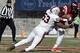 FILE - In this Nov. 26, 2016, file photo, Virginia linebacker Micah Kiser (53) wraps up Virginia Tech quarterback Jerod Evans (4) during the first half of an NCAA college football game in Blacksburg, Va. Kiser was selected to the 2017 AP All-Conference ACC team announced Tuesday, Dec. 5, 2017. (AP Photo/Steve Helber, File)
