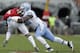 North Carolina's Andre Smith (56) tackles North Carolina State's Nyheim Hines (7) during the first half an NCAA college football game in Raleigh, N.C., Saturday, Nov. 28, 2015. (AP Photo/Gerry Broome)
