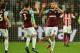 West Ham United's English striker Andy Carroll (R) celebrates scoring his team's first goal with West Ham United's English defender Aaron Cresswell during the English Premier League football match between West Ham United and Stoke City at The London Stadium, in east London on April 16, 2018. / AFP PHOTO / Glyn KIRK / RESTRICTED TO EDITORIAL USE. No use with unauthorized audio, video, data, fixture lists, club/league logos or 'live' services. Online in-match use limited to 75 images, no video emulation. No use in betting, games or single club/league/player publications. / (Photo credit should read GLYN KIRK/AFP/Getty Images)
