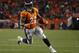Denver Broncos running back C.J. Anderson (22) runs against the New England Patriots during the second half of an NFL football game, Sunday, Nov. 12, 2017, in Denver. (AP Photo/Jack Dempsey)