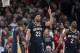 New Orleans Pelicans guard Jrue Holiday, forward Anthony Davis and guard Ian Clark celebrate a score against the Portland Trail Blazers during the second half in Game 1 of an NBA basketball first-round playoff series Saturday, April 14, 2018, in Portland, Ore. New Orleans won 97-95. (AP Photo/Randy L. Rasmussen)