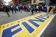 People gather at the Boston Marathon finish line in Boston, Sunday, April 15, 2018 ahead of Monday's race. (AP Photo/Michael Dwyer)