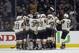 Vegas Golden Knights players celebrate after defeating the Los Angeles Kings 1-0, and sweeping the series in Game 4 of an NHL hockey first-round playoff series in Los Angeles, Tuesday, April 17, 2018. (AP Photo/Alex Gallardo)